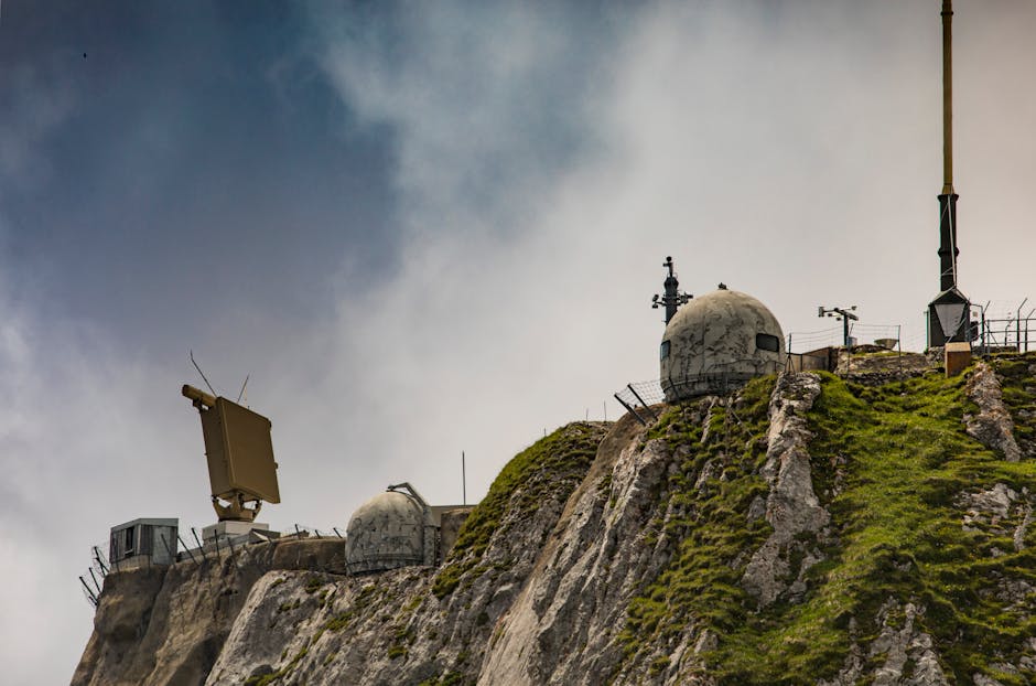 Drone-Killing Tech Is Emerging as a $20 Billion Defense Trade 1 Swiss radar system perched on a rugged mountainside, showcasing technical and natural contrast.