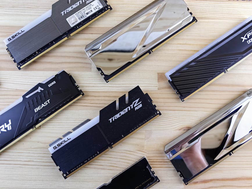RAM prices drop 20% as AI-fueled memory squeeze eases 1 Top view of modern computer RAM sticks arranged on a wooden surface for technology enthusiasts.